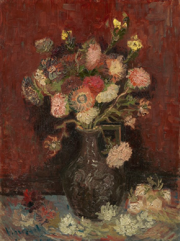 A bouquet of flowers in colours red, white and yellow in a vase